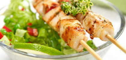 BBQ Selection with lime and fresh salad leaves